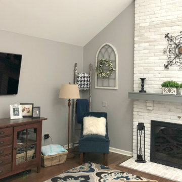 Family room with white painted brick