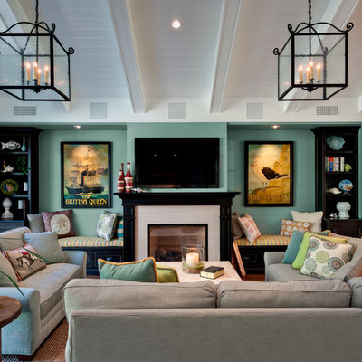 Inspiration for a mid-sized timeless open concept family room remodel in San Francisco with a standard fireplace, a wall-mounted tv, green walls and a stone fireplace