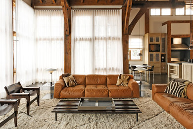 Living room - rustic open concept dark wood floor living room idea in New York with beige walls