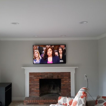 Farmington Hills TV over fireplace, with custom wall plates.