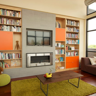 Family room - contemporary dark wood floor family room idea in Chicago with beige walls, a ribbon fireplace, a metal fireplace and a wall-mounted tv