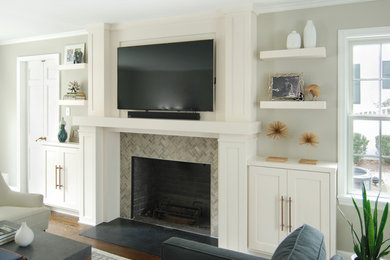 Example of an arts and crafts family room design in New York with beige walls, a tile fireplace and a wall-mounted tv