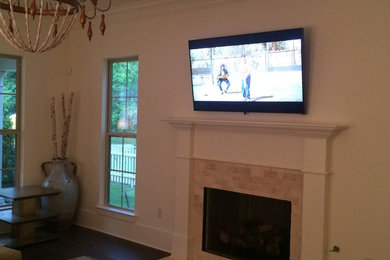 Inspiration for a timeless family room remodel in New Orleans with a wall-mounted tv