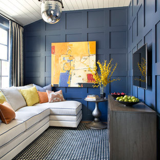 Family room - mid-sized transitional enclosed medium tone wood floor and brown floor family room idea in Boise with blue walls, no fireplace and a wall-mounted tv