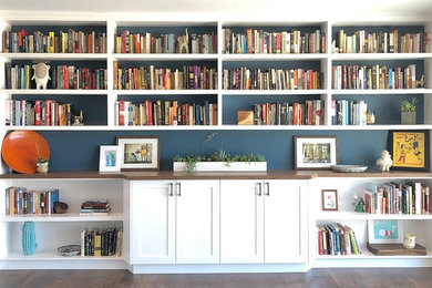 Family room library - mid-sized contemporary enclosed dark wood floor and brown floor family room library idea in San Diego