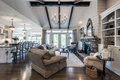Mid-sized farmhouse open concept dark wood floor and brown floor family room photo in New York with beige walls, a standard fireplace and a stone fireplace