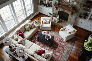 Example of a farmhouse family room design in Little Rock