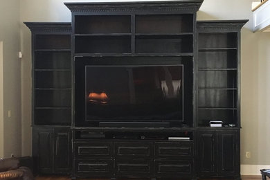 Inspiration for a rustic family room remodel in Nashville with a tv stand