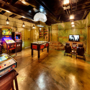 Inspiration for a tropical concrete floor and brown floor family room remodel in Kansas City with no fireplace and multicolored walls
