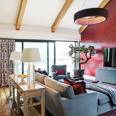 Mid-sized country enclosed medium tone wood floor family room photo in San Francisco with red walls and a tv stand