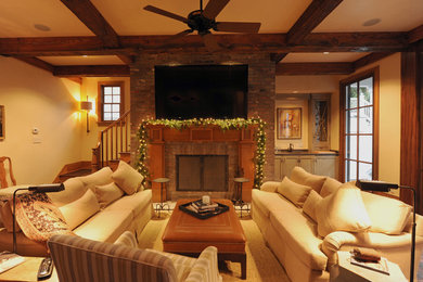 Large mountain style open concept dark wood floor family room photo in New Orleans with a bar, a standard fireplace, a brick fireplace, a wall-mounted tv and white walls
