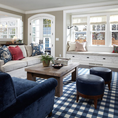 Elegant dark wood floor and brown floor family room photo in Minneapolis with beige walls and a standard fireplace