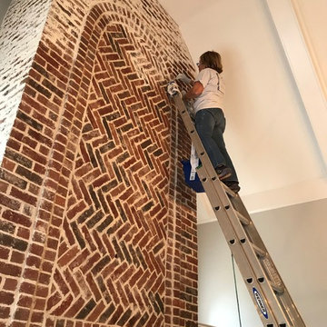 German Schmear on two story brick fireplace