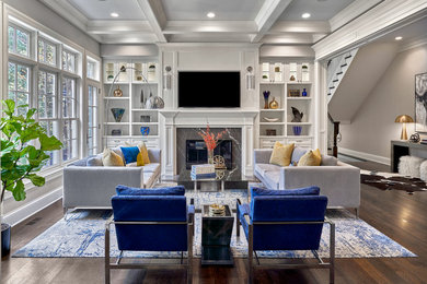 Inspiration for a mid-sized transitional open concept medium tone wood floor, brown floor and coffered ceiling family room remodel in Chicago with gray walls, a stone fireplace and a wall-mounted tv