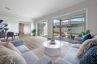 Immagine di un soggiorno minimalista di medie dimensioni con pavimento in vinile