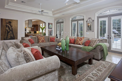 Inspiration for a timeless family room remodel in Miami with beige walls