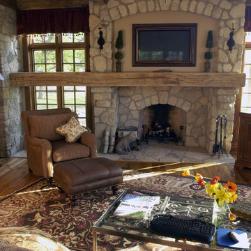 Great Room Featuring Custom Stone Fireplace with Built-in Plasma TV Screen Above