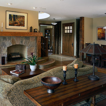 Great Room Featuring Stained Concrete Floors and Raised Hearth Stone Fireplace