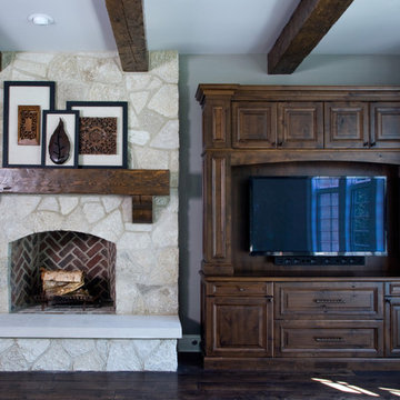 Great Room featuring Stone Fireplace with Hand Hewn Timber Mantle