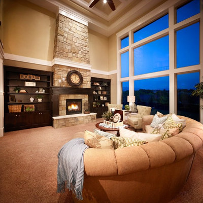 Family room - large traditional open concept carpeted and brown floor family room idea in Salt Lake City with beige walls, a standard fireplace, a stone fireplace and no tv