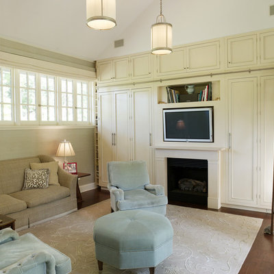 Trendy family room photo in New York with beige walls, a standard fireplace and a media wall