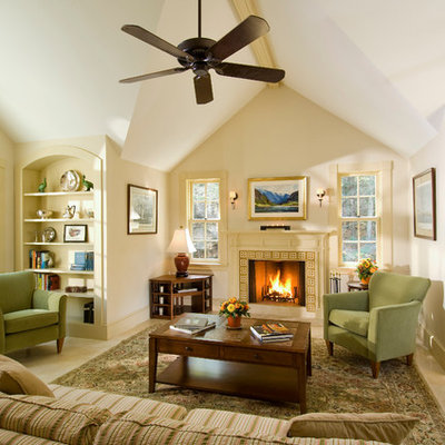 Example of a mid-sized classic carpeted family room design in Boston with beige walls, a standard fireplace, no tv and a tile fireplace