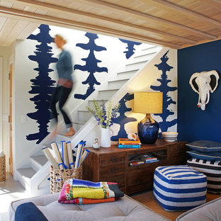 Family room library - mid-sized contemporary enclosed light wood floor and beige floor family room library idea in Boston with blue walls