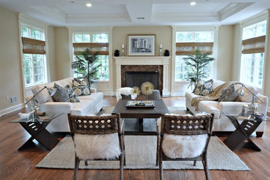 Example of a large transitional enclosed dark wood floor family room design in New York with gray walls, a standard fireplace and a stone fireplace