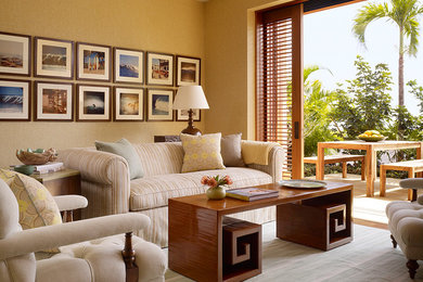 Family room - mid-sized tropical open concept medium tone wood floor family room idea in Hawaii with beige walls