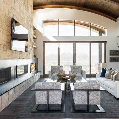 Family room - rustic open concept dark wood floor family room idea in Salt Lake City with a ribbon fireplace, a wall-mounted tv and white walls
