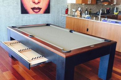 Inspiration for a medium sized modern open plan games room in Orange County with a game room, white walls and medium hardwood flooring.