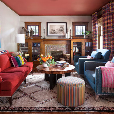 Family room - eclectic medium tone wood floor and brown floor family room idea in Denver with white walls, a standard fireplace and a tile fireplace