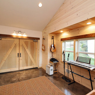 Mid-sized urban concrete floor and gray floor family room photo in Seattle with no fireplace, beige walls and a music area
