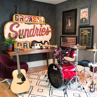Mid-sized eclectic open concept medium tone wood floor and brown floor family room photo in Other with a music area and gray walls