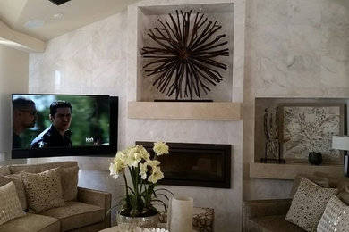 Example of a mid-sized transitional enclosed family room design in Orange County with white walls, a ribbon fireplace, a tile fireplace and a wall-mounted tv