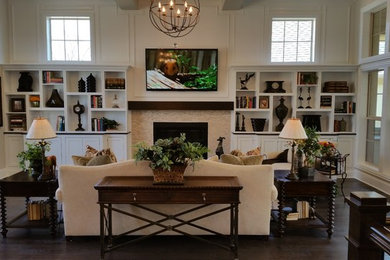 Inspiration for a large transitional open concept dark wood floor family room remodel in Columbus with white walls, a standard fireplace, a tile fireplace and a wall-mounted tv