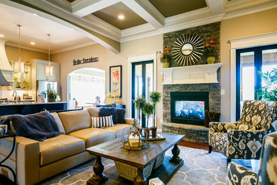 Family room - large traditional open concept dark wood floor family room idea in Louisville with beige walls, a standard fireplace, a stone fireplace and a media wall