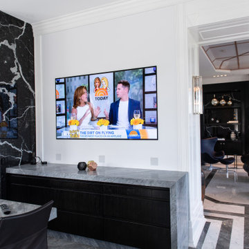 Kitchen area featuring an LG OLED wallpaper TV with Sonance Architectural Series