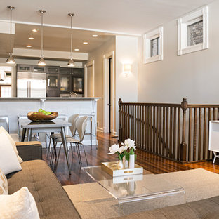 Inspiration for a mid-sized modern open concept medium tone wood floor family room remodel in Chicago with gray walls and a wall-mounted tv
