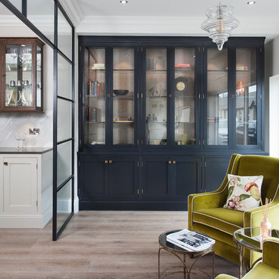 Mid-sized transitional open concept light wood floor and beige floor family room photo in Dublin with no tv