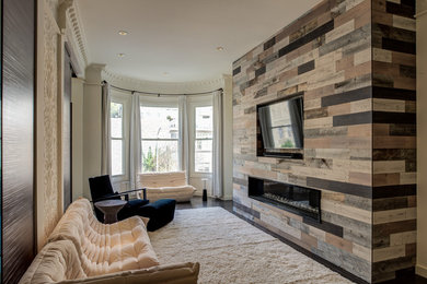 Family room - mid-sized contemporary enclosed dark wood floor and brown floor family room idea in San Francisco with a ribbon fireplace, white walls, a wood fireplace surround and a wall-mounted tv