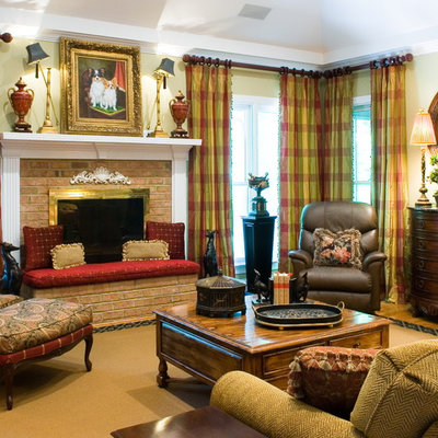Elegant medium tone wood floor family room photo in Atlanta with beige walls, a standard fireplace, a brick fireplace and no tv