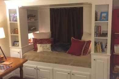 Example of a transitional dark wood floor family room library design in DC Metro with beige walls, no fireplace and no tv