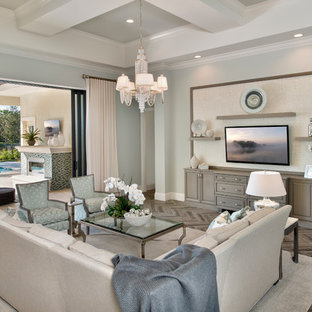 Transitional open concept family room photo in Tampa with a wall-mounted tv and blue walls
