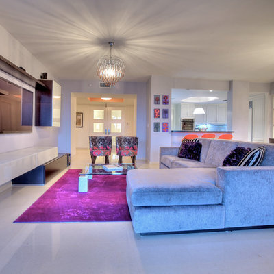 Mid-sized trendy open concept porcelain tile family room photo in Miami with gray walls and a wall-mounted tv