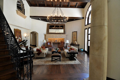 Example of a tuscan family room design in San Diego