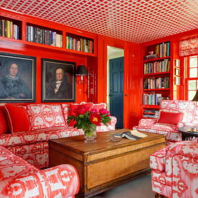 Example of a small eclectic enclosed family room library design in Burlington with red walls