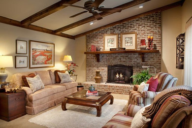 Inspiration for a mid-sized rustic enclosed carpeted family room remodel in Philadelphia with a standard fireplace, a brick fireplace and no tv