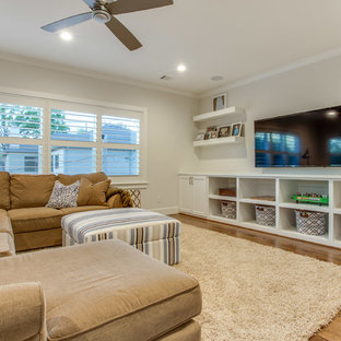 Family room - large transitional open concept medium tone wood floor family room idea in Dallas with white walls, no fireplace and a wall-mounted tv
