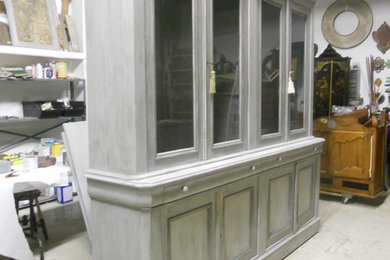 Large bookcase painted in tones of grey